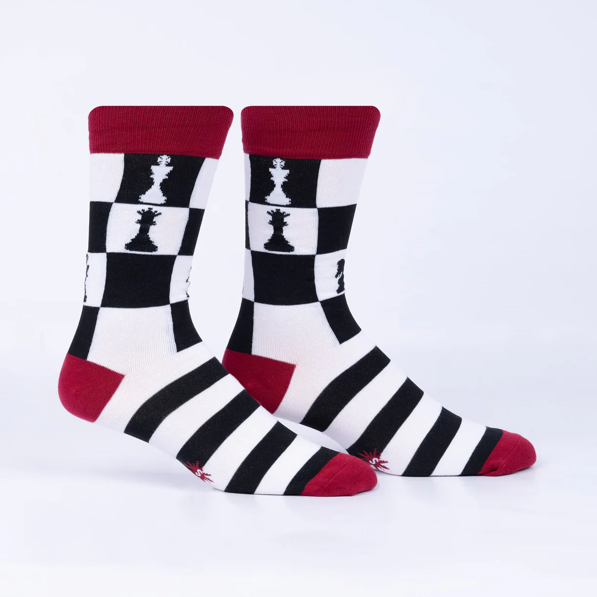 Pair of socks with chess-themed design on a white background