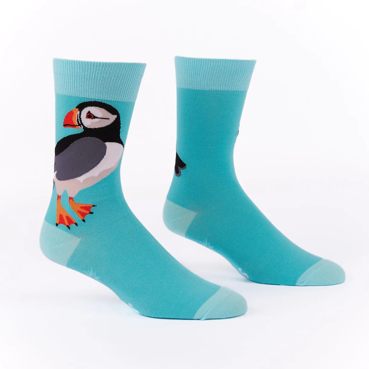 Turquoise socks with a puffin design on a white background