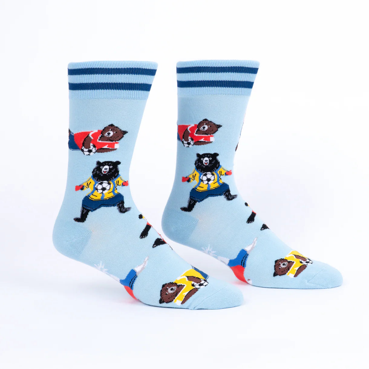 Light blue socks with bear and soccer design on a white background