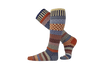 A pair of knee-high socks with a multicolor geometric and tribal pattern, featuring shades of orange, blue, red, yellow, and brown on a white background.
