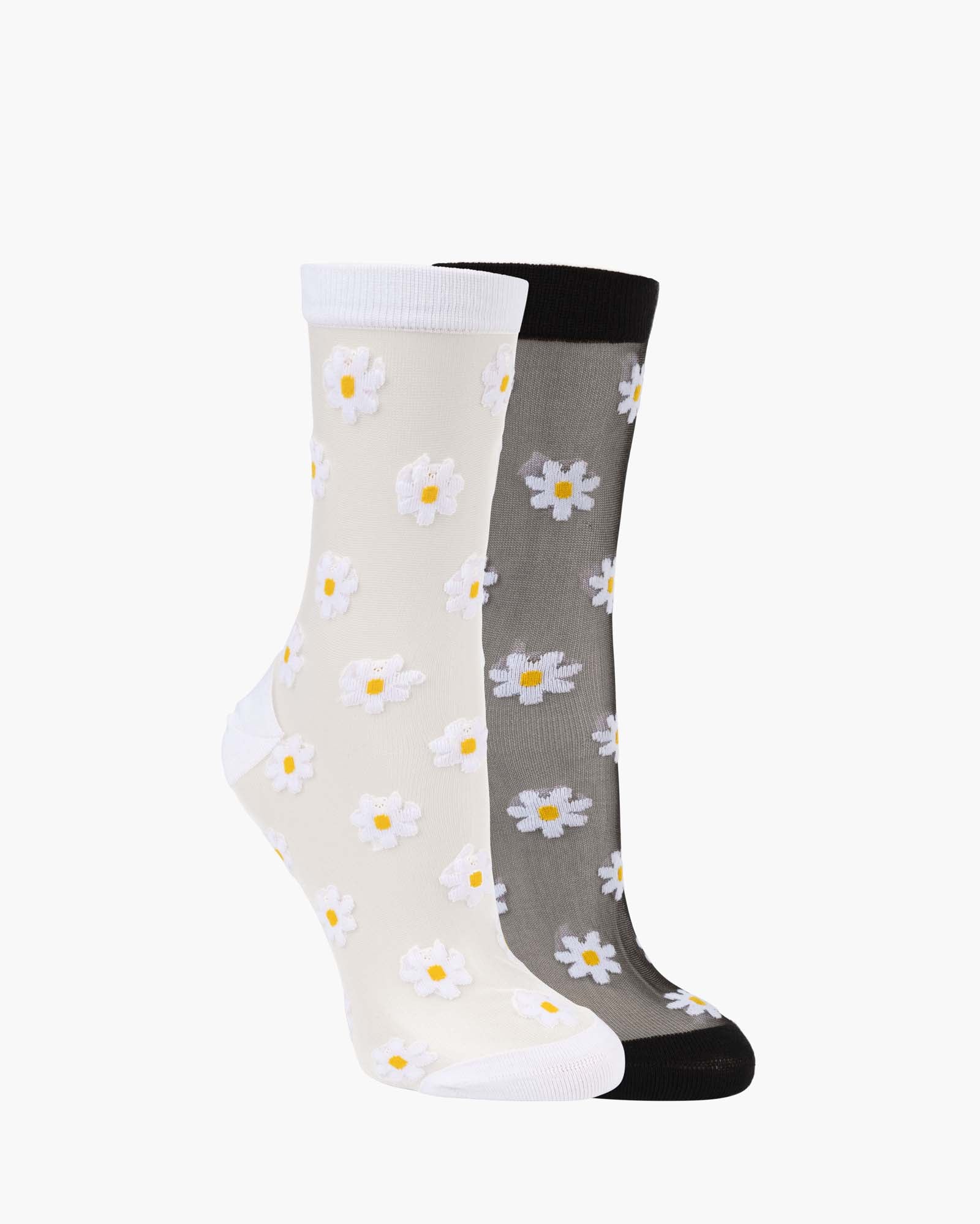 A pair of crew socks with a daisy pattern, shown overlapping. One sock is off-white with white daisies that have yellow centers and a white cuff/toe.