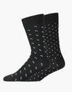Two black socks with small white and blue patterns on a white background