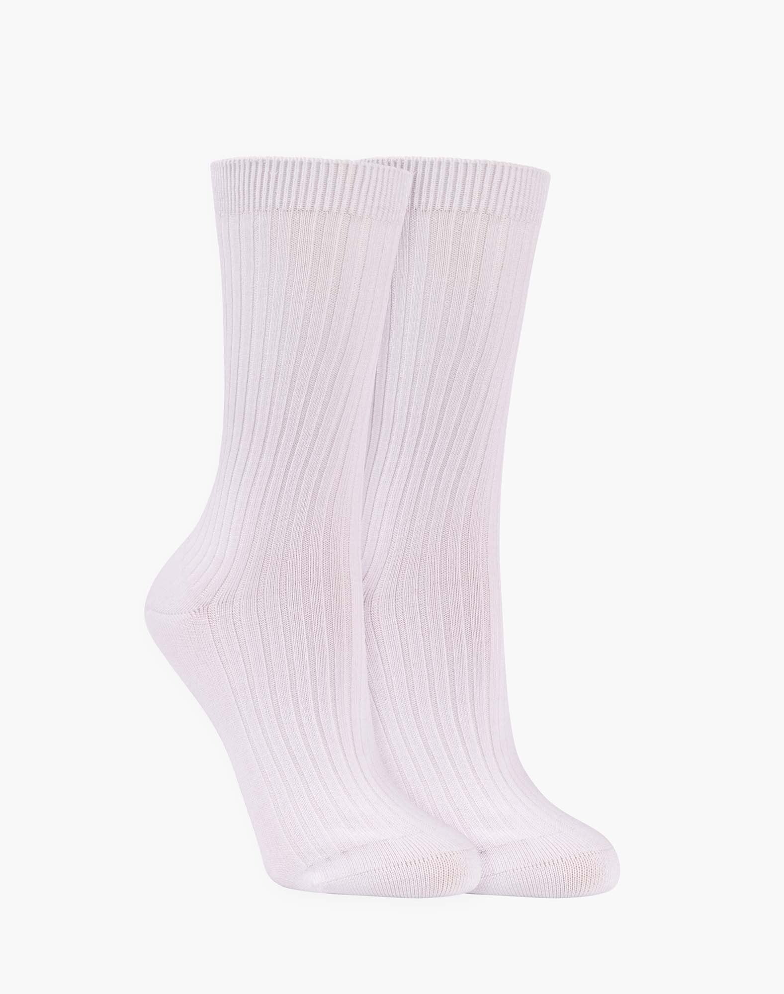 Pair of white ribbed socks on a white background