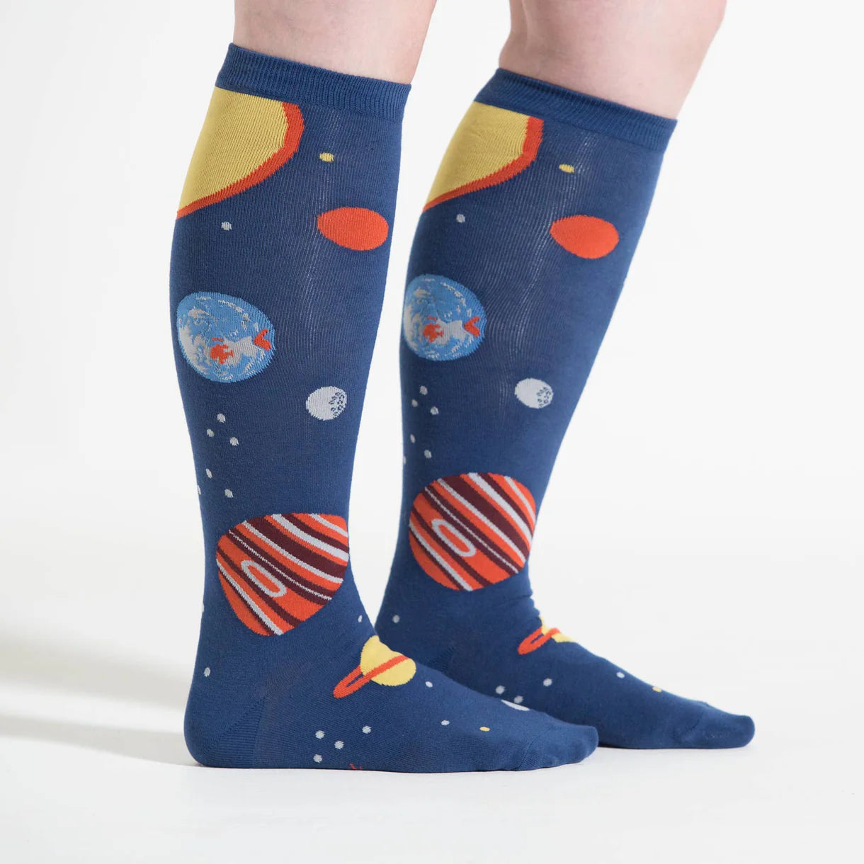 Knee-high socks with space-themed design on a white background