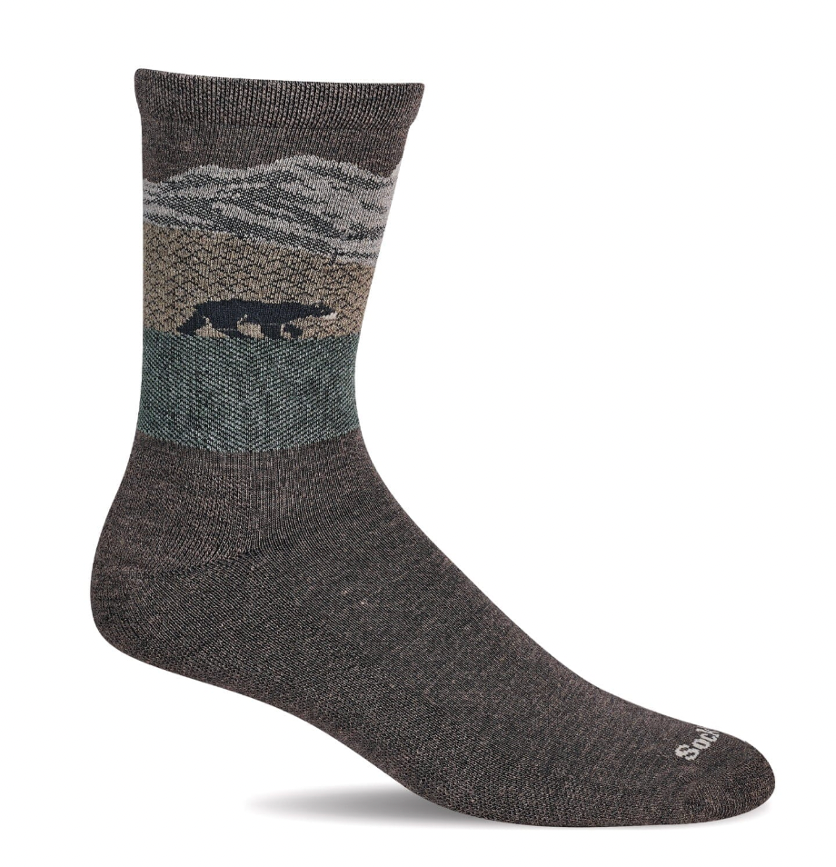 Gray sock with a mountain and bear design on a white background