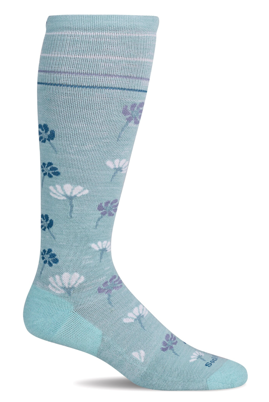 Light blue sock with floral pattern on a white background