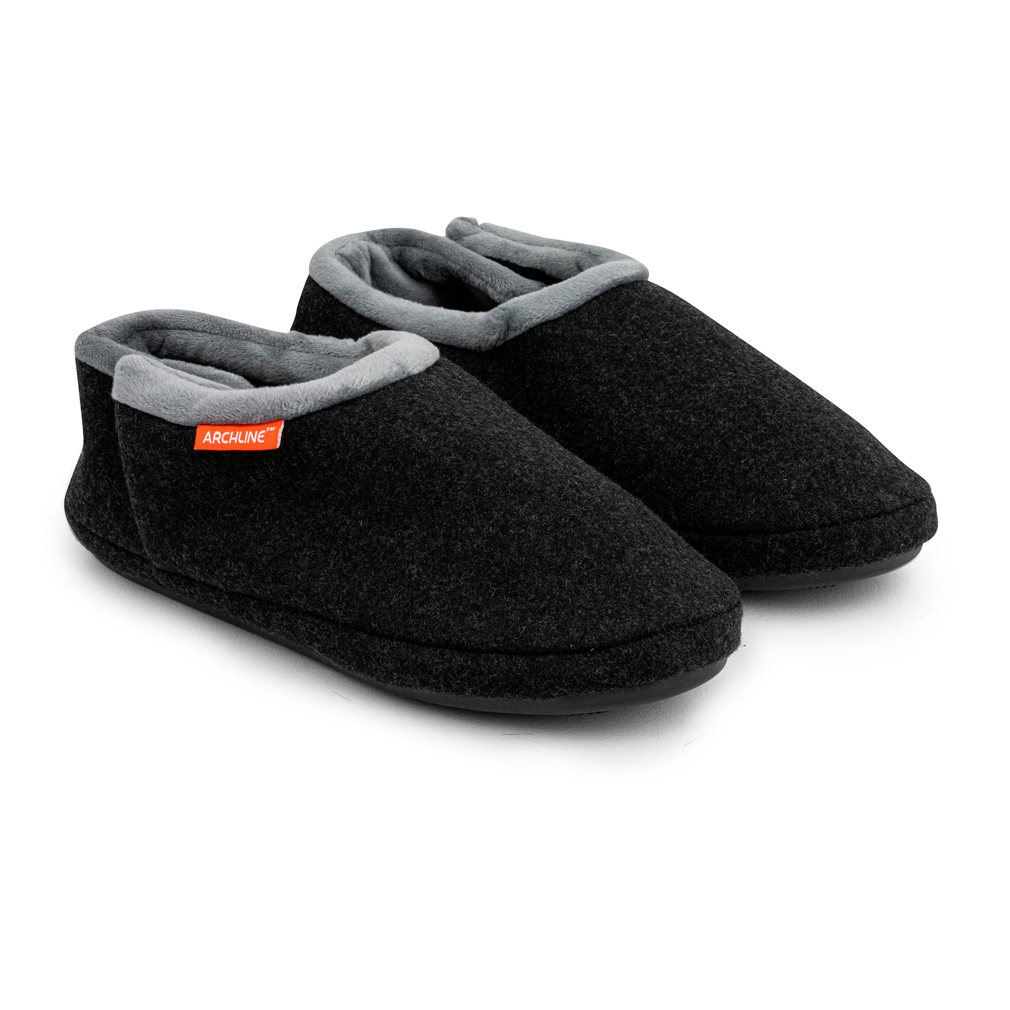 Pair of black slippers with gray interior on a white background