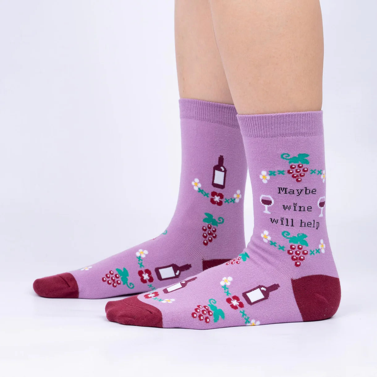 Purple socks with wine-themed designs and text on a white background