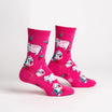 Pink socks with a strawberry milk design and cows