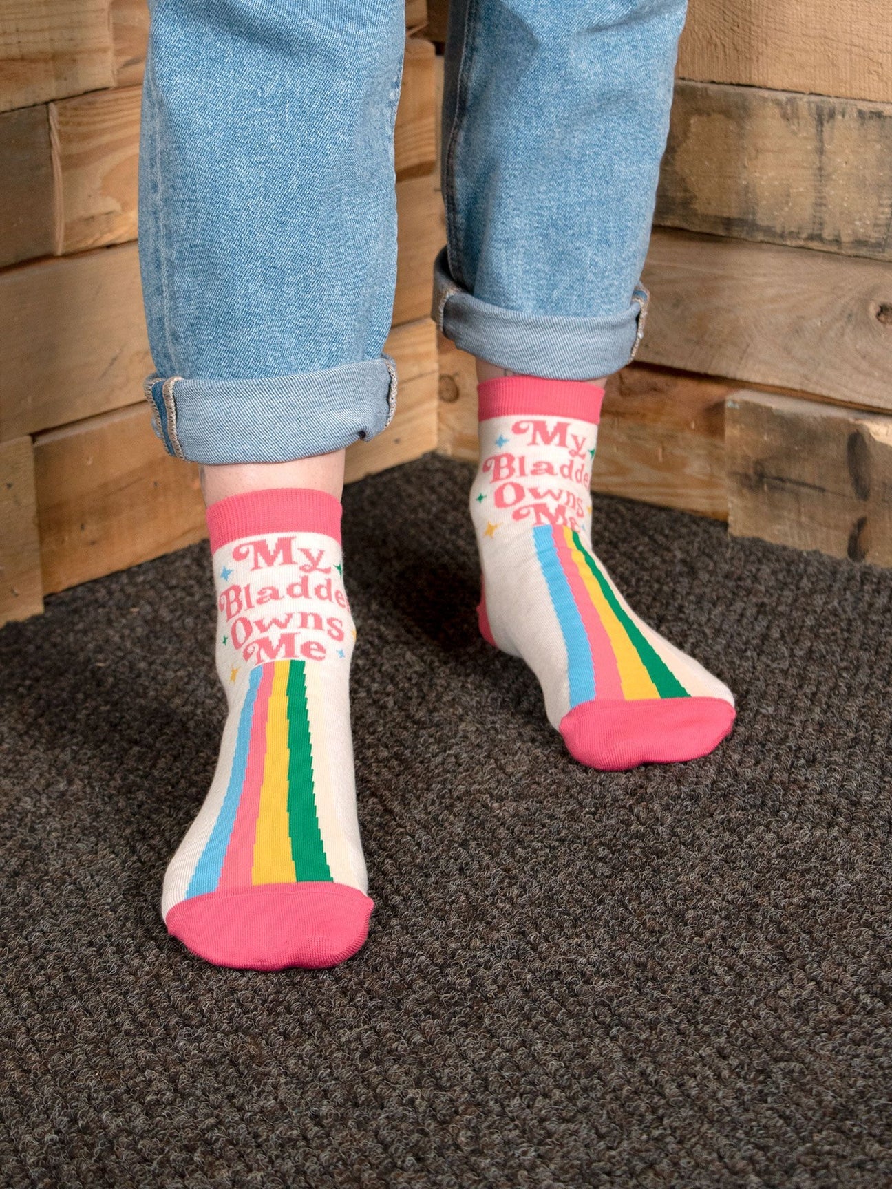 Colourful socks with text 'My Bladder Owns Me' 