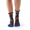 Colorful patterned socks with a peacock worn by a person on a white background
