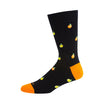 Black sock with orange accents and small fruit patterns on a white background