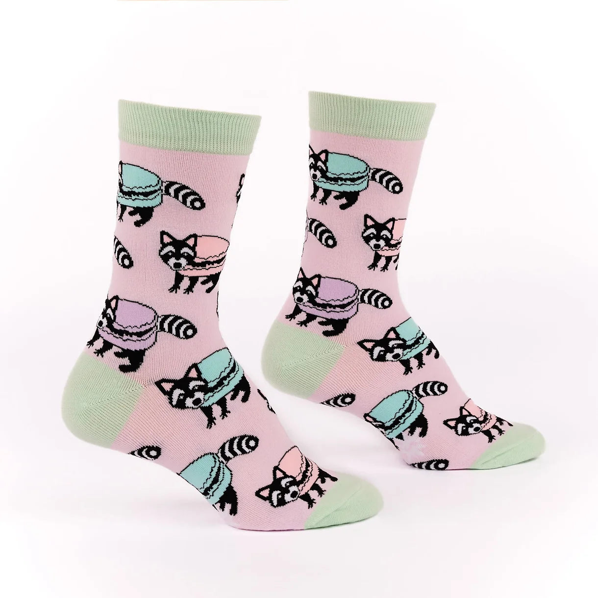 Pink socks with raccoon design on a white background