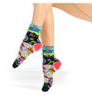 Colorful floral-patterned socks worn by a person on a white background