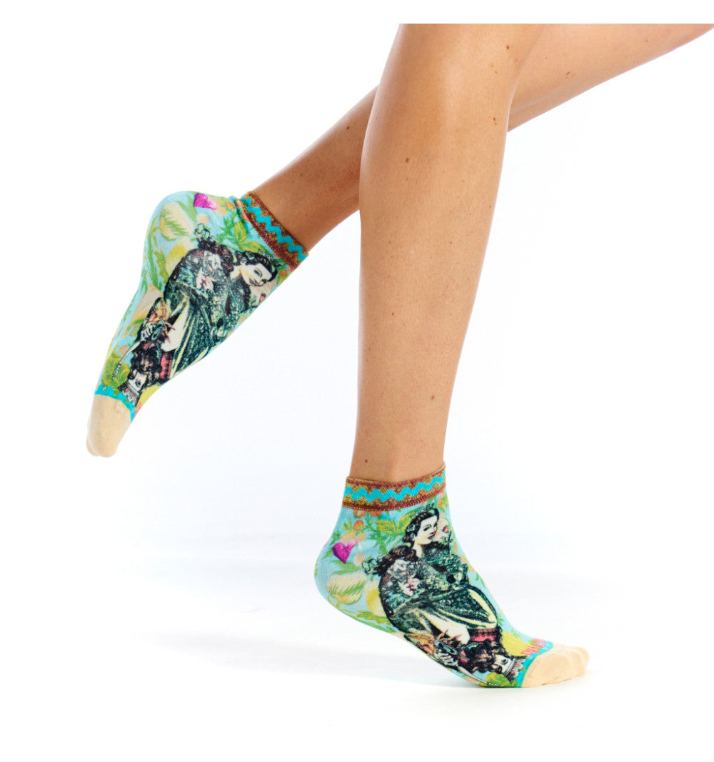 Colorful socks with a design of a woman and child on a white background
