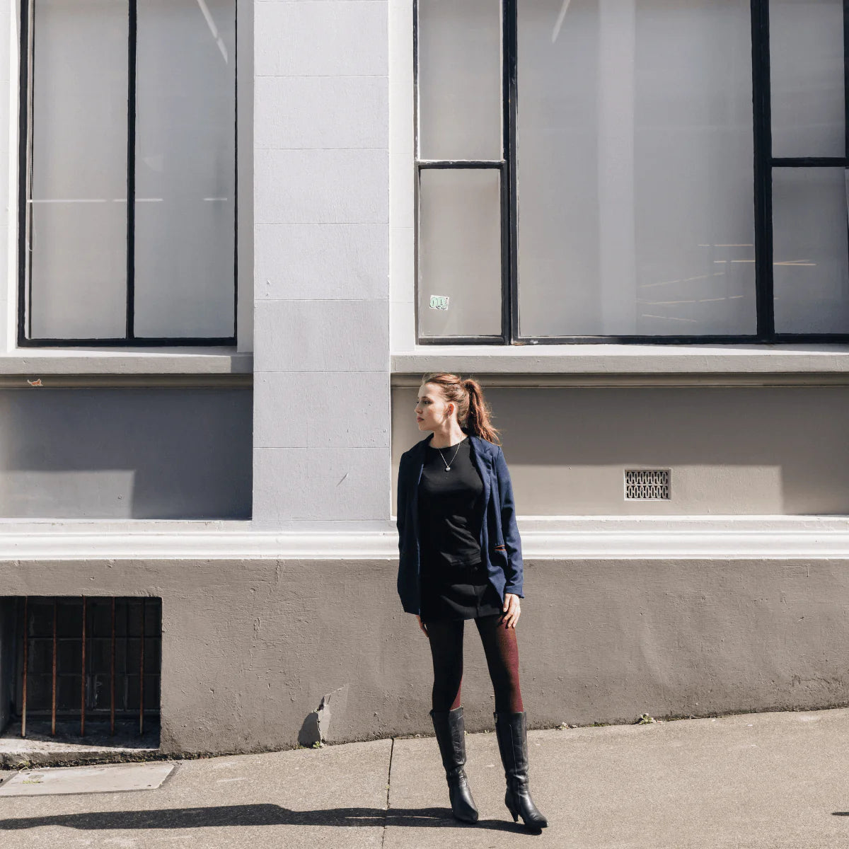 model wearing berry coloured merino wool tights - The Sockery