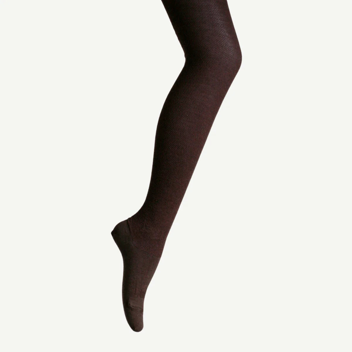 Dark brown tights worn by a person on a white background
