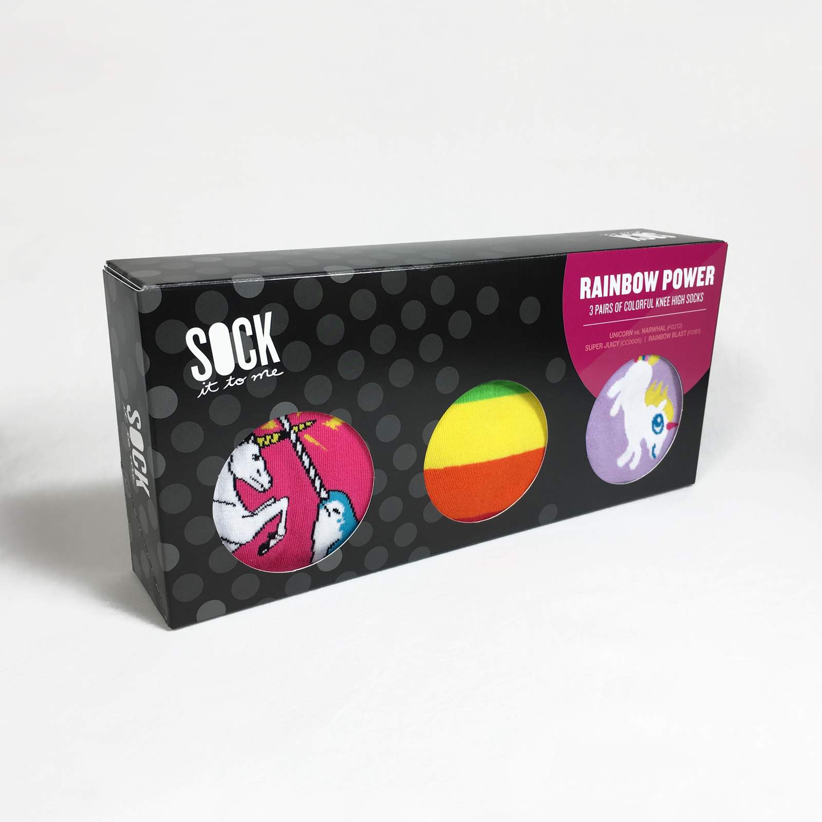 A black gift box with three pairs of knee high socks, which are visible through cutouts in the lid - The Sockeryc