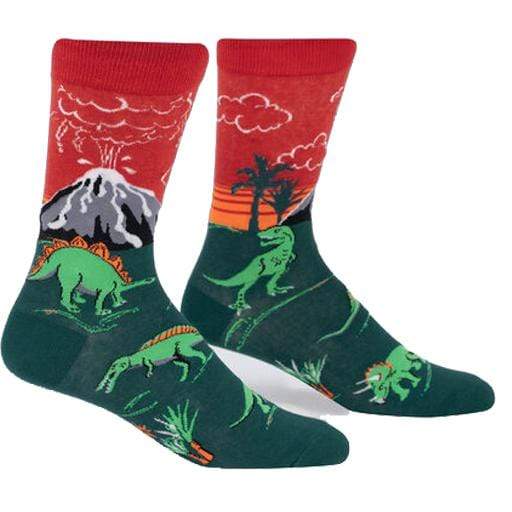 Green and red socks with an erupting volcano and dinosaurs on it. The words "glows in the dark" in the upper right hand corner - The Sockery