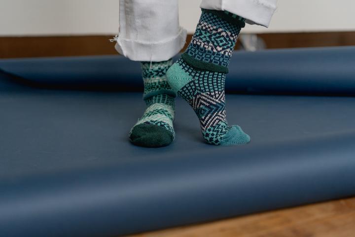 person wearing recycled cotton patterned socks