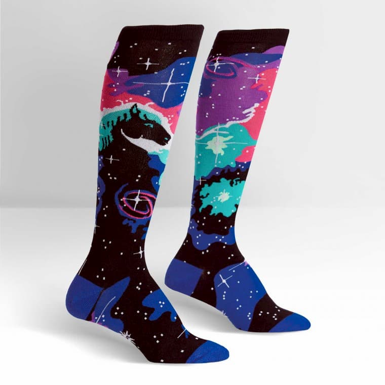 Knee high socks in black, purple, pink and blue, along with turquoise and white. There is a black horse head and white stars - The Sockery 