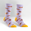 lilac coloured womens novelty crew sock with sausage dogs some in a hot dog bun, heel and toe yellow