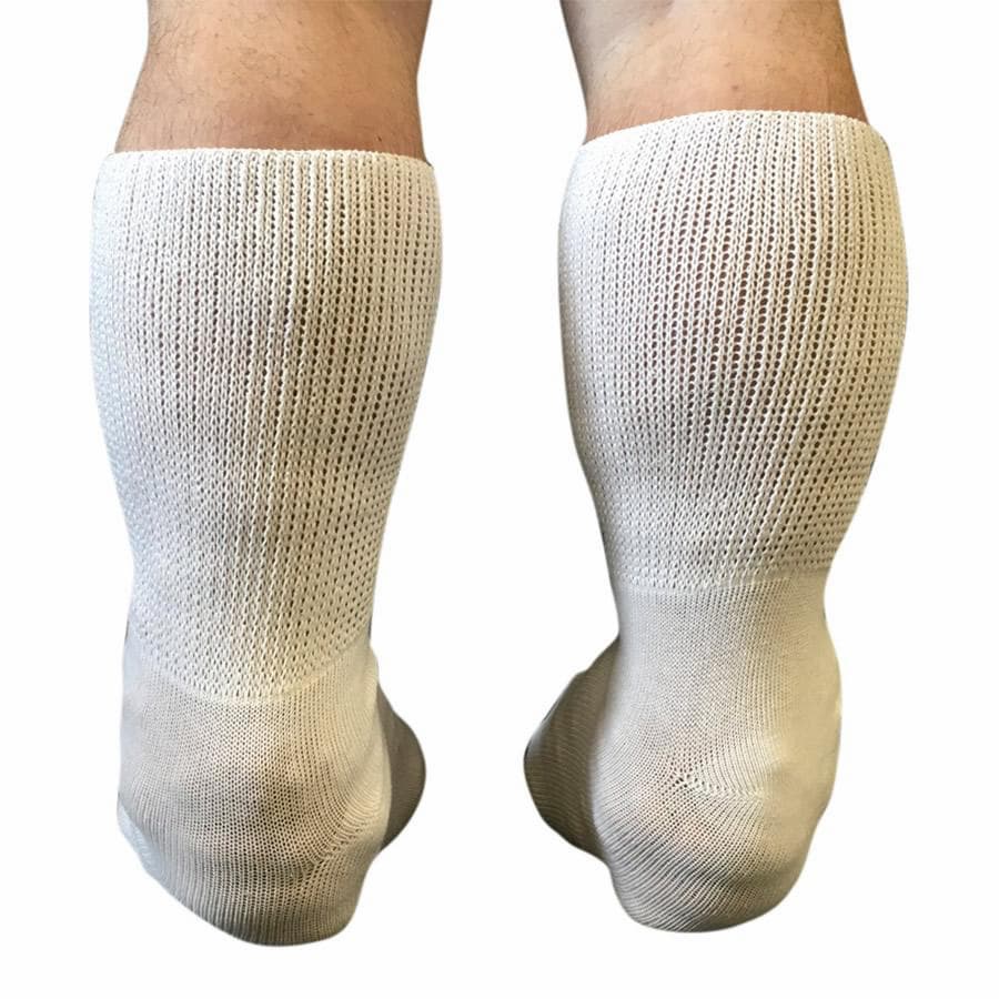Back view of a person with wide calfs wearing white bariatric socks - The Sockery