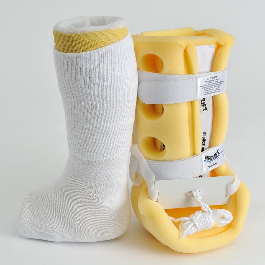 An AFO or CAM boot next to a white extra wide medical crew sock - The Sockery