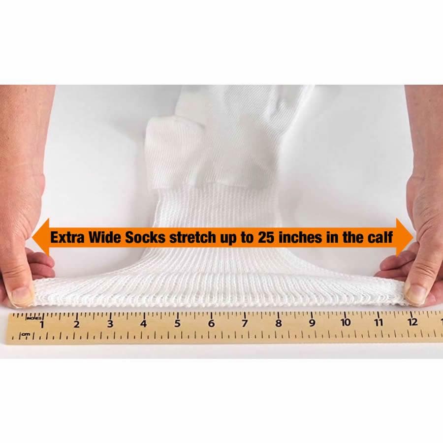 Someone stretching the top of an extra wide athletic sock in white along a ruler, which shows it stretches to 12'' (30.5 cm), which means the sock is suitable for a calf up to 25'' (64cm) - The Sockery