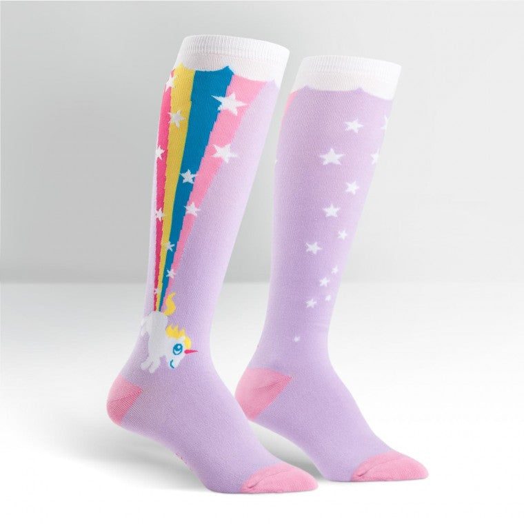 Lilac knee high socks with a white unicorn on the ankle. It's shooting a rainbow and stars form its bottom. The rainbow stretches all the way up the calf, meeting a cloud which goes around the cuff - The Sockery