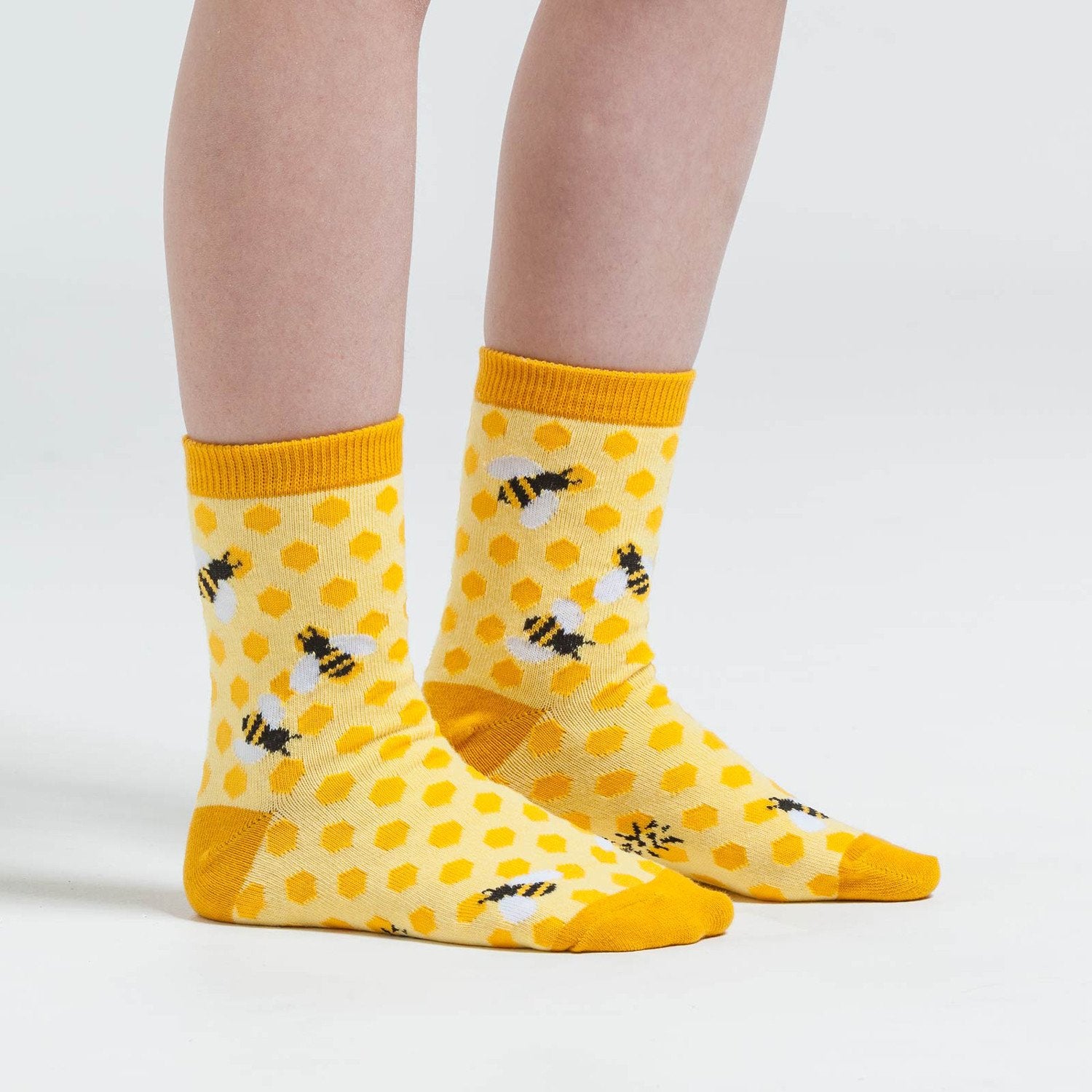 Sunshine yellow sock with honeycomb design and cute buzzy bees - The Sockery